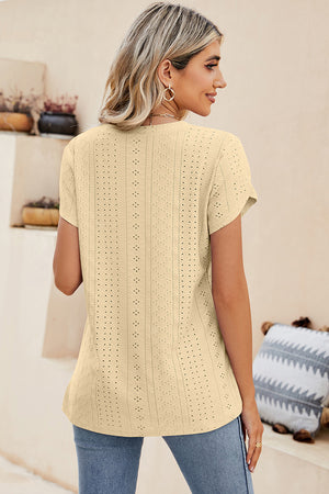 Light Yellow eyelet V-neck top with short sleeves and a casual fit.