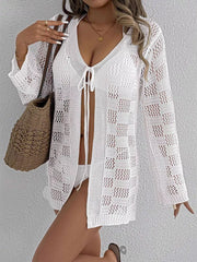 White openwork tie-front crochet cover-up with a v-neck and long sleeves.