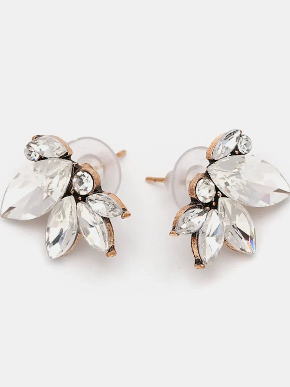 Gemstone petal cluster stud earrings in antique gold with clear crystals.