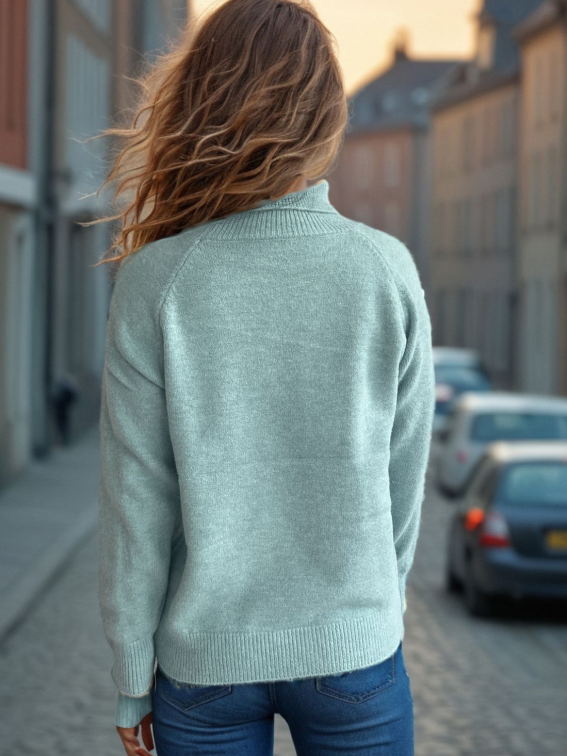 Relaxed raglan turtleneck knit sweater in Pastel Blue with ribbed cuffs and hem.