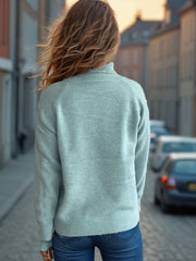 Relaxed raglan turtleneck knit sweater in Pastel Blue with ribbed cuffs and hem.