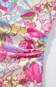 Floral one-piece swimsuit with ruched side detail in fuchsia pink.