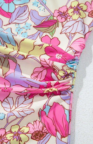 Floral one-piece swimsuit with ruched side detail in fuchsia pink.