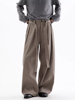 Men's wide leg check trousers in beige and brown with a tie belt and pleats.