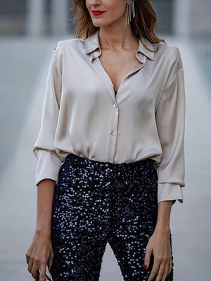 Beige collared button-up maternity shirt with long sleeves and a relaxed fit.