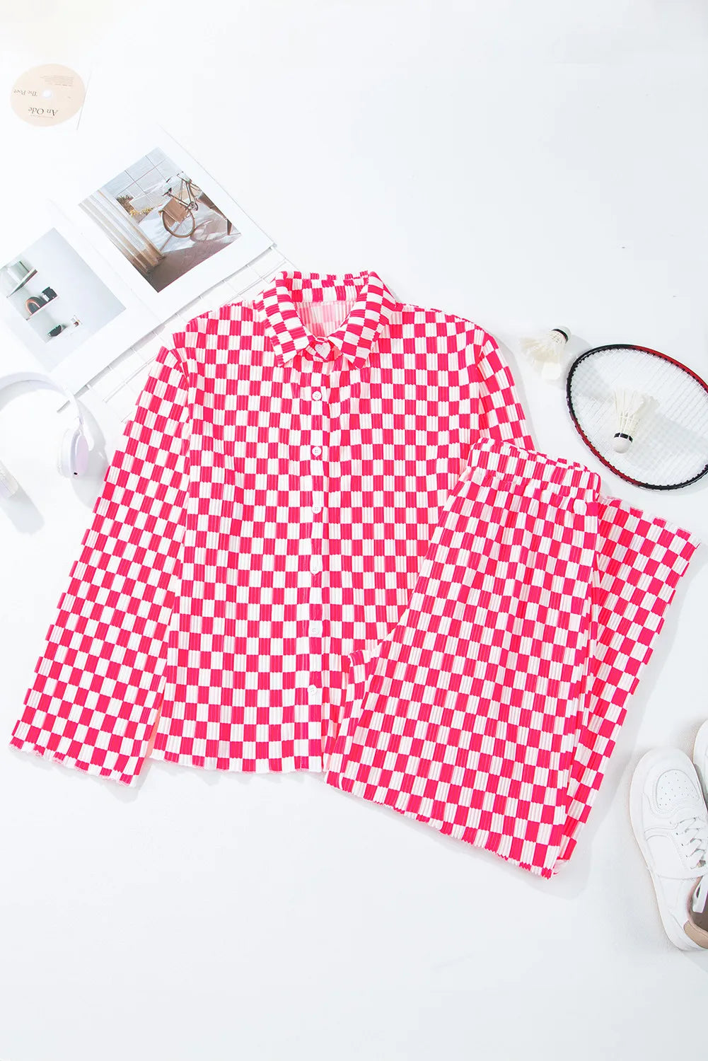 Pleated pink and white checkered lounge set with collared shirt and pants.