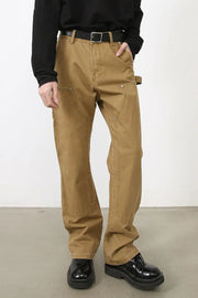 Carpenter-inspired camel wide leg trousers with utility pockets and a hammer loop detail.