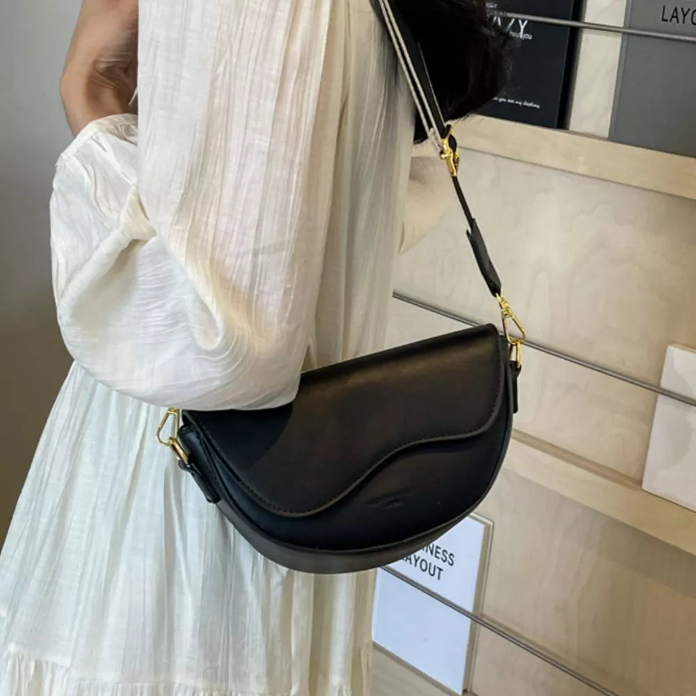 Leather Crescent Crossbody Bag in Black, close-up detail