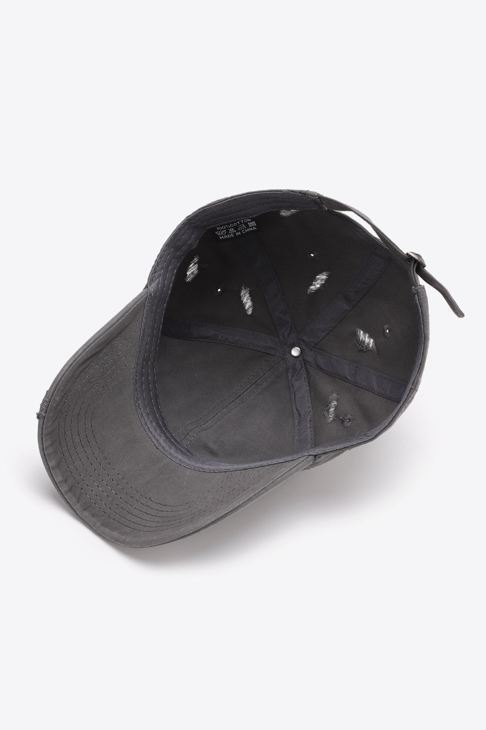 Mid Gray distressed baseball cap with adjustable strap and visible interior tags.