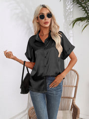 Black satin boxy sleeve blouse with button-down front and cuffed sleeves.