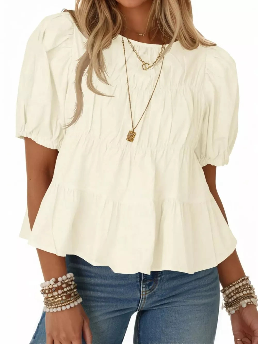 Cream white ruffled maternity blouse with puff sleeves and ruched bodice.