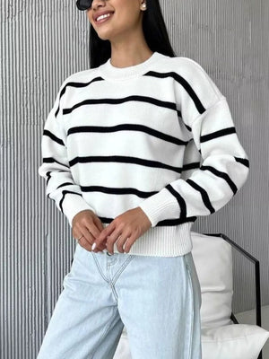 Classic striped knit sweater with round neck in white and black.