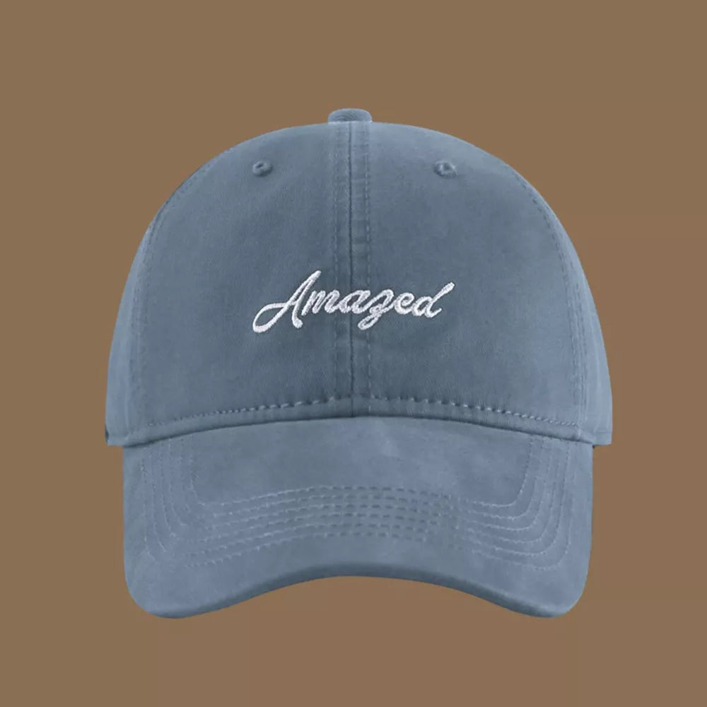 Mist Blue cotton baseball cap with white embroidered "Amazed" text.