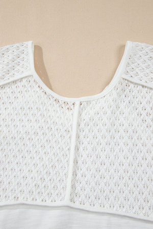 White lace-inset dolman sleeve blouse with a scoop neckline and open knit detail.