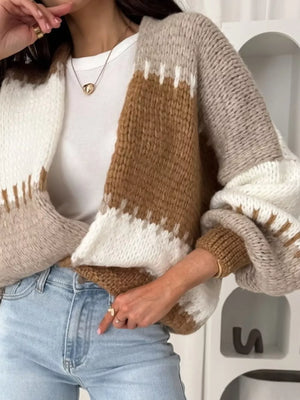 Brown and white striped open front cardigan with balloon sleeves.