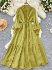 Yellow-green textured tiered long sleeve button-down midi dress with tie waist