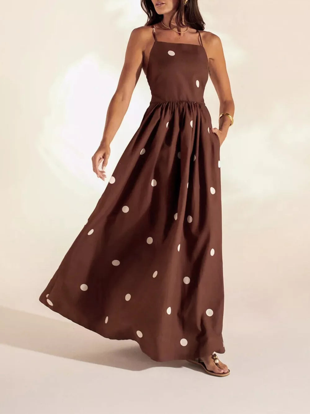 Brown polka dot maxi dress with pockets, square neck, spaghetti straps, ankle length.