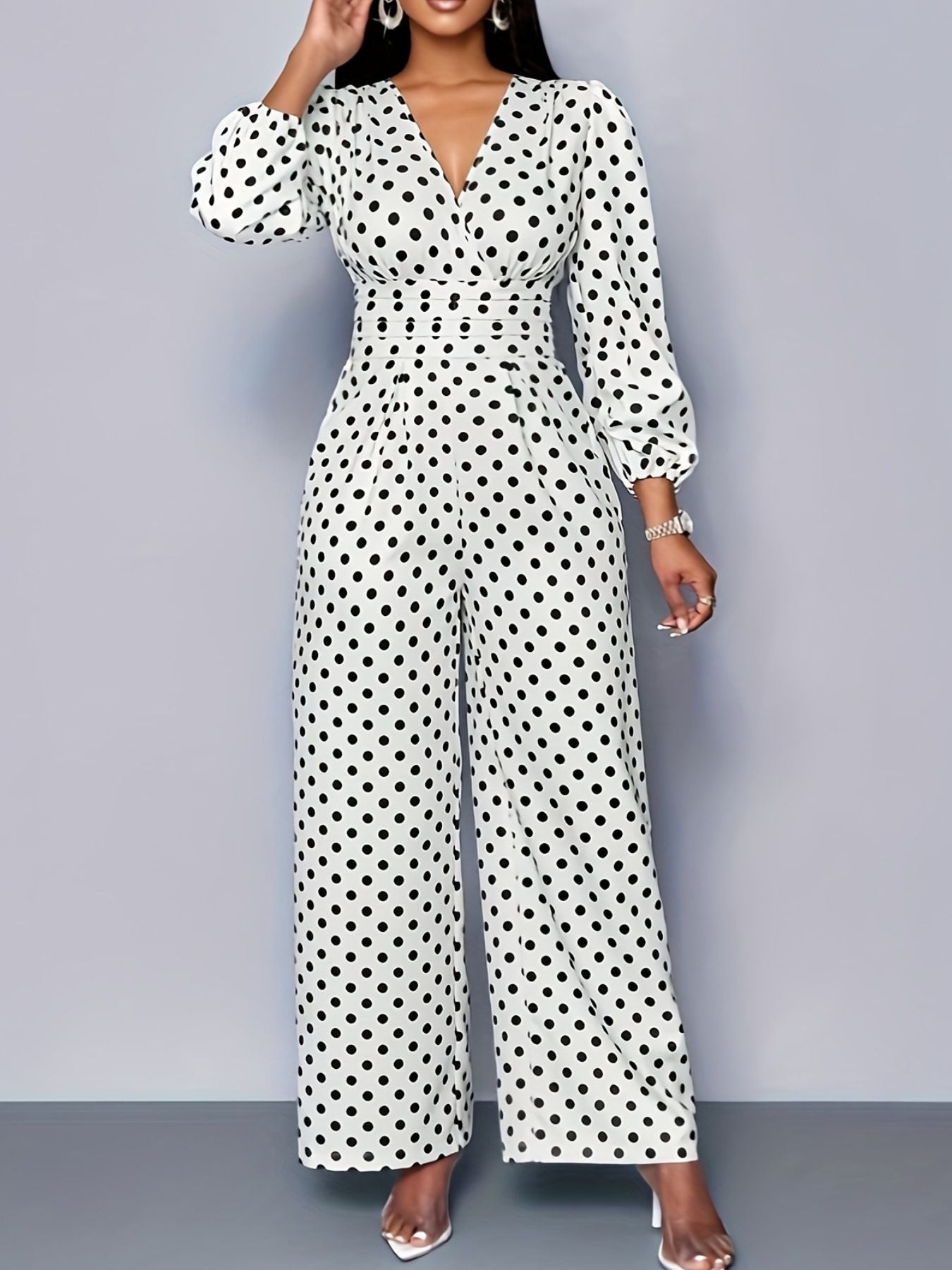 Chic white polka dot jumpsuit with balloon sleeves, V-neck, and wide legs.