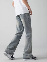 Men's light blue wide-leg jeans with a relaxed fit and vintage wash.
