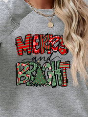 Crewneck sweatshirt with Merry and Bright Christmas graphic in red and green patterns.