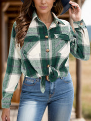 Checked plaid button-down overshirt in dark green with white and grey accents, tied at the waist.