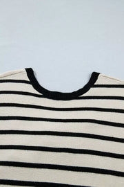 Chic stripe knit top with black trim neckline and black horizontal stripes.