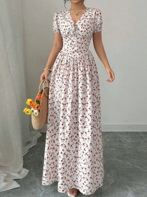 Floral print maxi dress with V-neck, short sleeves, and drawstring detail.