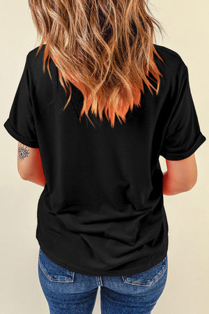 Black t-shirt with rolled sleeves and a graphic print on the back.