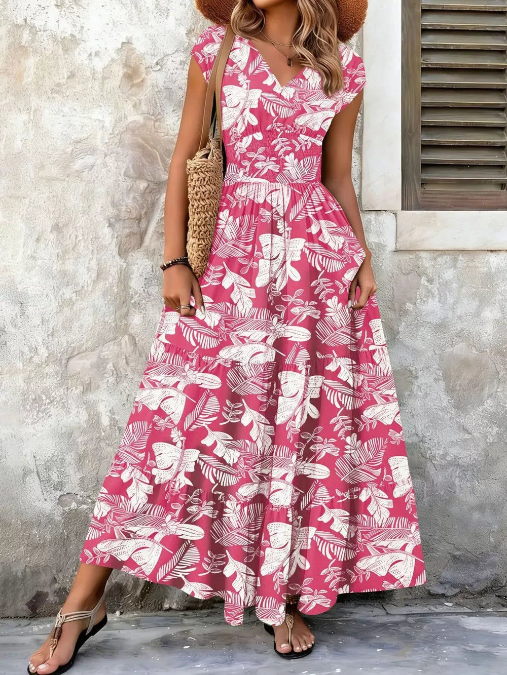 Elegant tiered maxi dress in Strawberry floral print with smocked bodice and V-neck.