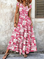 Elegant tiered maxi dress in Strawberry floral print with smocked bodice and V-neck.