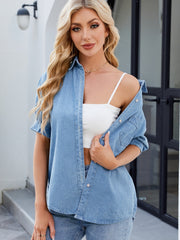Medium wash denim button-down blouse with short sleeves and a collared neckline.