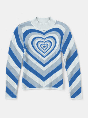 Mock neck sweater with blue, grey, and white chevron stripes and a concentric heart pattern.