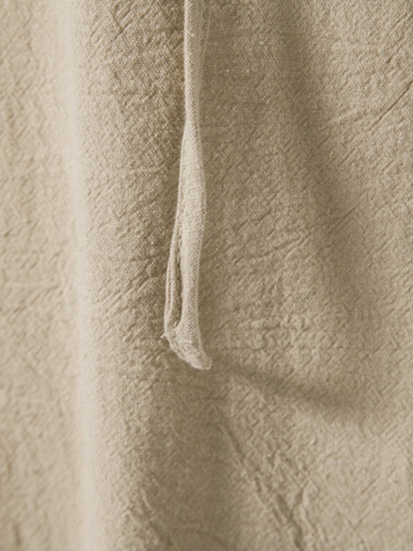 Men's beige cotton lace-up hooded top detail