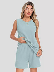 Ribbed knit set in Air Force Blue with sleeveless top and shorts, featuring pockets.