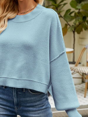Misty Blue acrylic dropped shoulder knit sweater with crew neck and balloon sleeves.