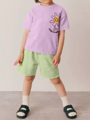 Girls' lavender cotton blend tee with daisy graphic and light green shorts.