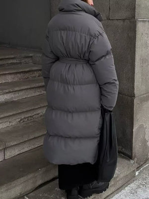 Dark gray padded trench coat with tie-belt and high collar, long sleeves, midi length.