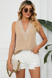 Lace-trimmed V-neck tank top in cream with a relaxed fit.