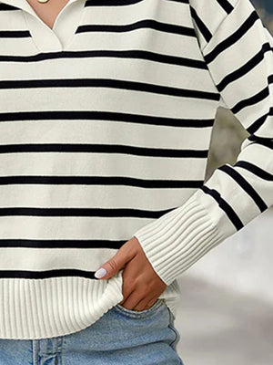 Striped polo knit sweater with a v-neck and ribbed cuffs.