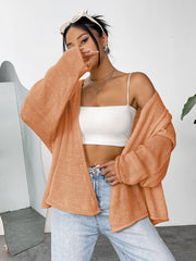 Open-front slouchy knit cardigan in sherbet acrylic with relaxed sleeves.