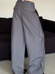 Men's grey pinstripe wide leg sweatpants with flap pockets.