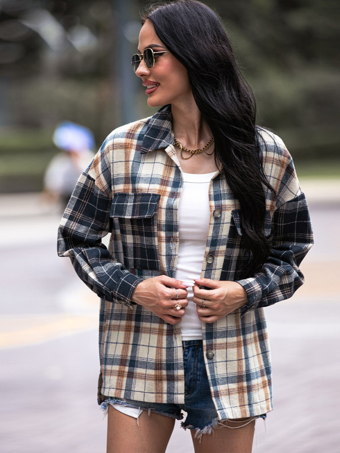 Colorblock plaid utility shacket in navy with button front and chest pockets.