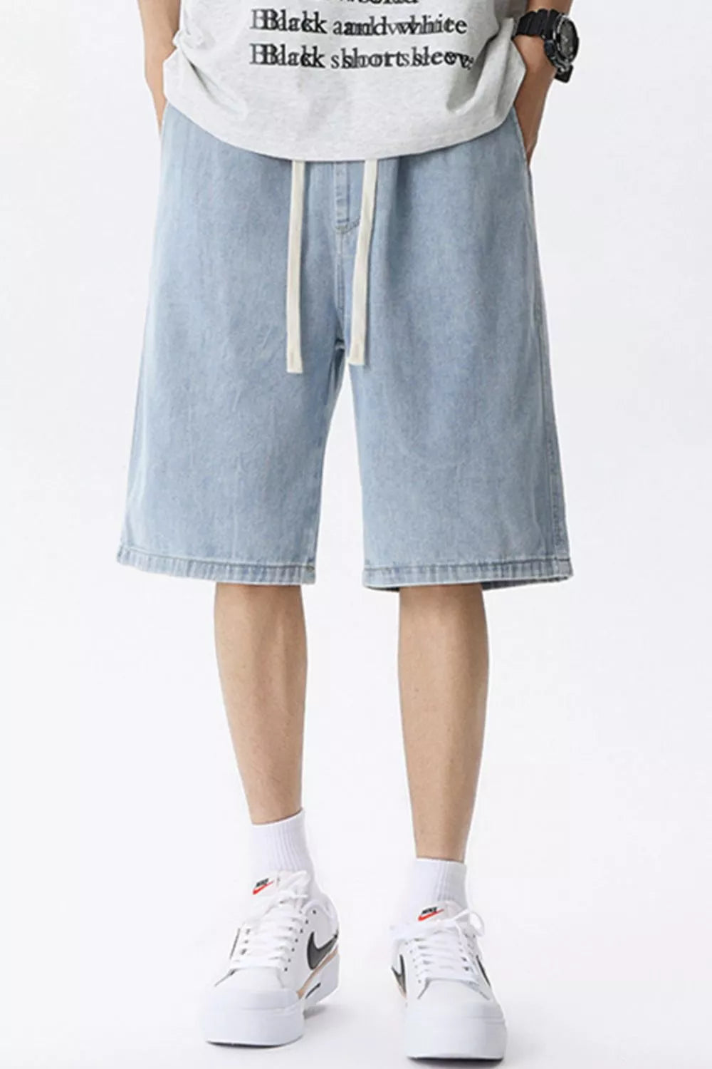 Light blue denim shorts for men with drawstring waist and vintage wash