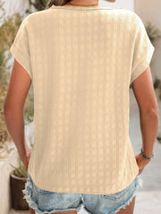 Tan woven texture cap-sleeve blouse with cuffed sleeves and a relaxed fit.