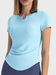 Pastel blue ribbed active top with notch neck and short sleeves