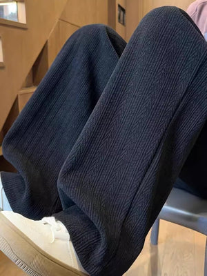 Textured wide leg sweatpants in black with a vertical ribbed pattern.