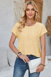 Light Yellow perforated eyelet cuffed tee with short sleeves and a round neckline.