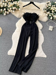 Black strapless wide-leg jumpsuit with feather trim and belt