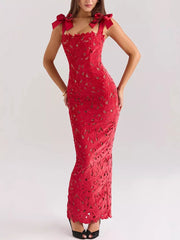 Red floral lace maxi dress with tie shoulder straps and cutout details.