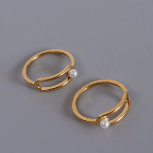 Gold sculptural ring with pearl accent, minimalist modern jewelry